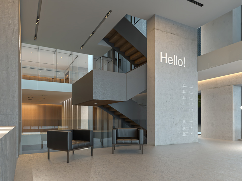 Concrete is not purely a structural element. As demonstrated in the perspective, the material is gaining significant traction in the world of office spaces and furnishings elements. The design employed a monochromatic palette of concrete, brushed steel sheets, and frameless glass railings and partitions on both the interior and exterior of the building. This airy, light-filled lobby space is grounded by the gray concrete floor, which contrasts nicely with the textured steel stairs. The rough finish of the c